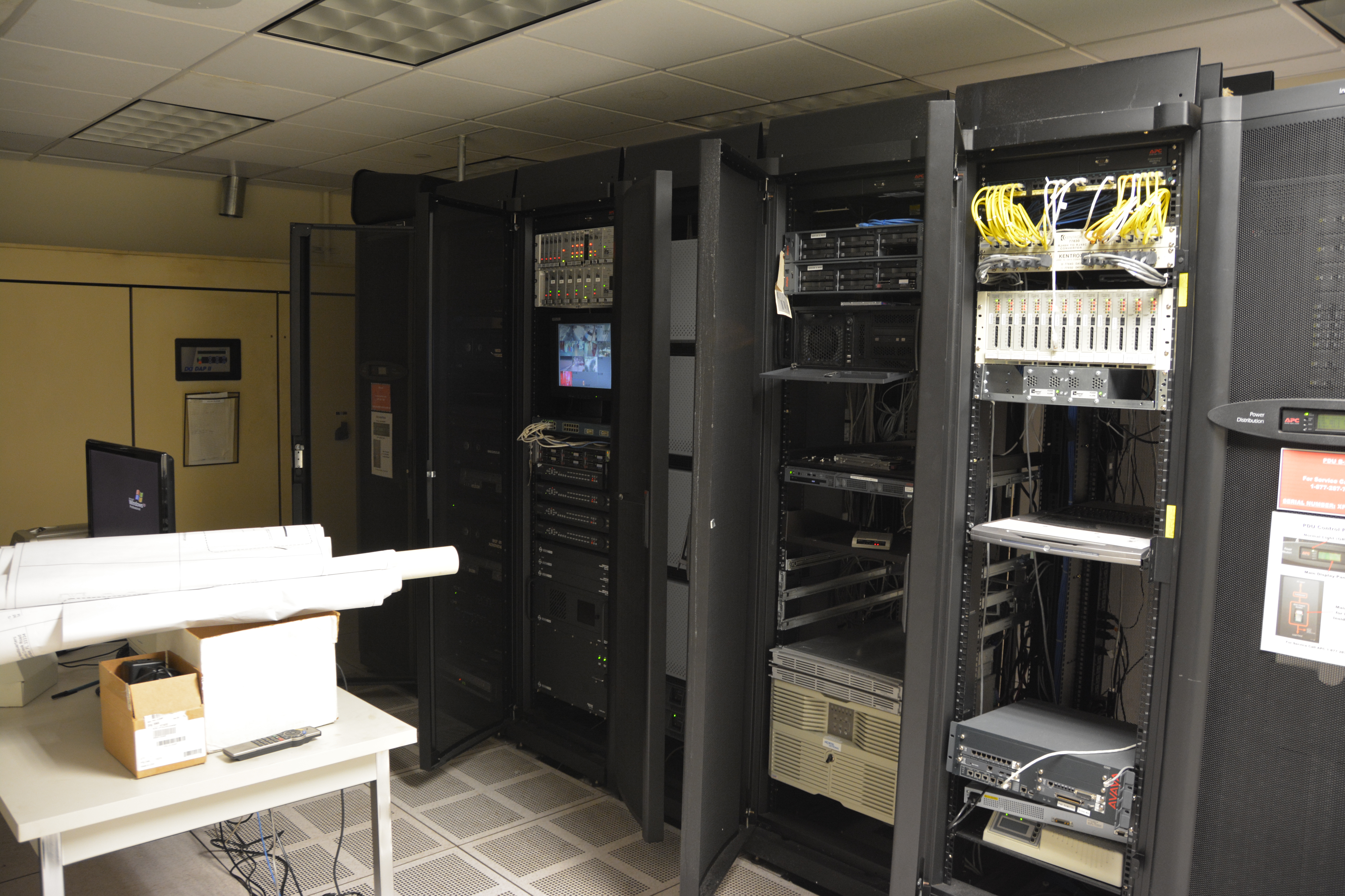 Rows of servers in a blue-lit data center